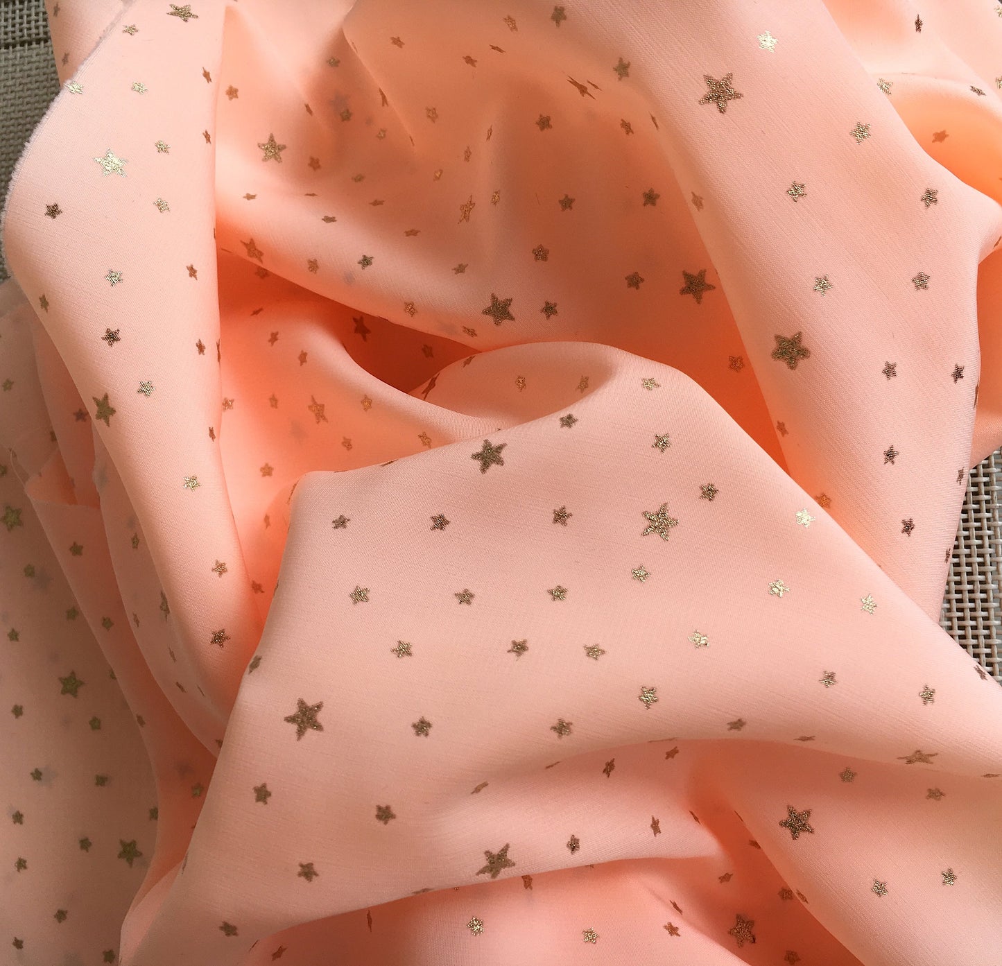 tissu polyester orange étoiles dorées